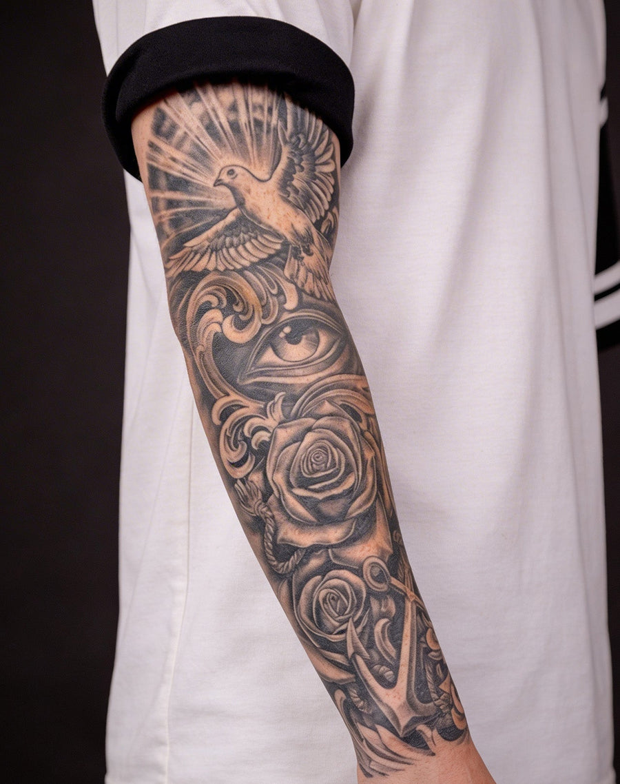 Dove and eye sleeve temporary tattoo on an arm